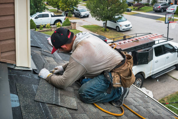 Professional Roof Replacement technician working in Mulberry, AR